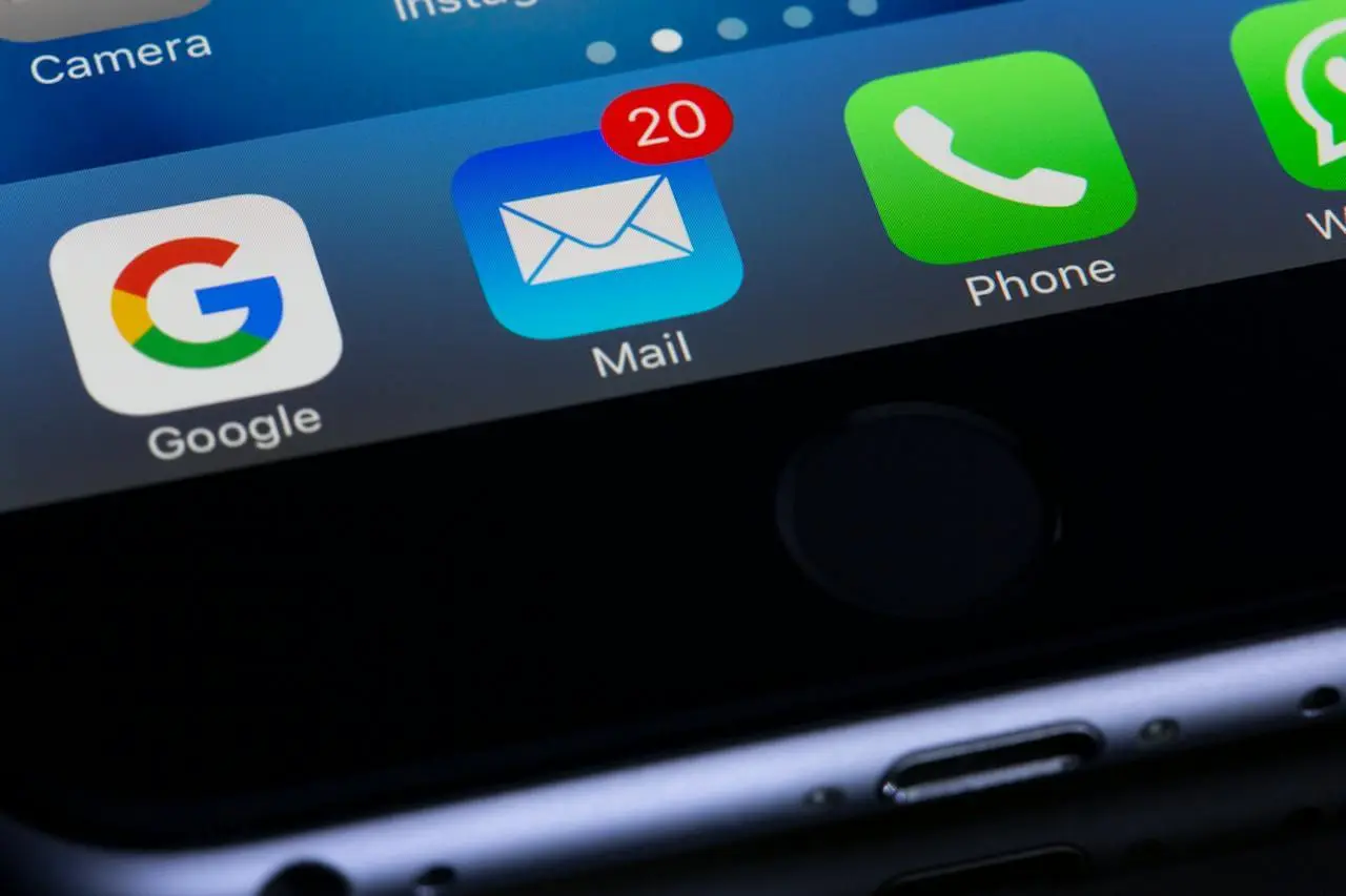 Close-up image of an iPhone screen with the Mail app showing twenty notifications.
